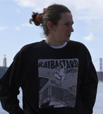 Man wearing the black Shredding Rat Crewneck sweatshirt outdoors